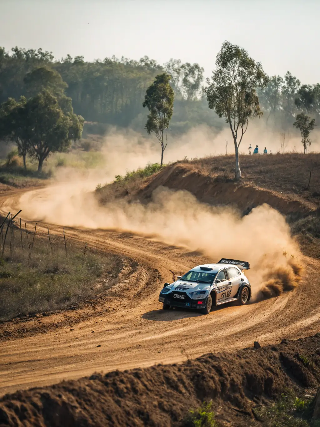 A vibrant photograph capturing the excitement of a local rally race organized by ECURIE VESUBIENNE AUTOMOBILE, showcasing cars speeding through a challenging course with enthusiastic spectators in the background.